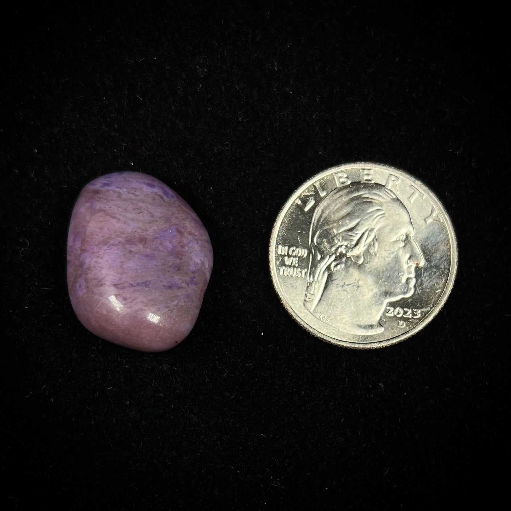 A tumbled, AAA grade, turkiyenite purple jade stone from Bursa, Turkey.