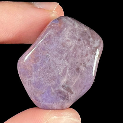 A piece of natural, tumbled purple turkiyenite jade.  Material from Turkey.