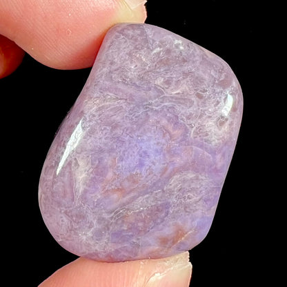 A piece of natural, tumbled purple turkiyenite jade.  Material from Turkey.