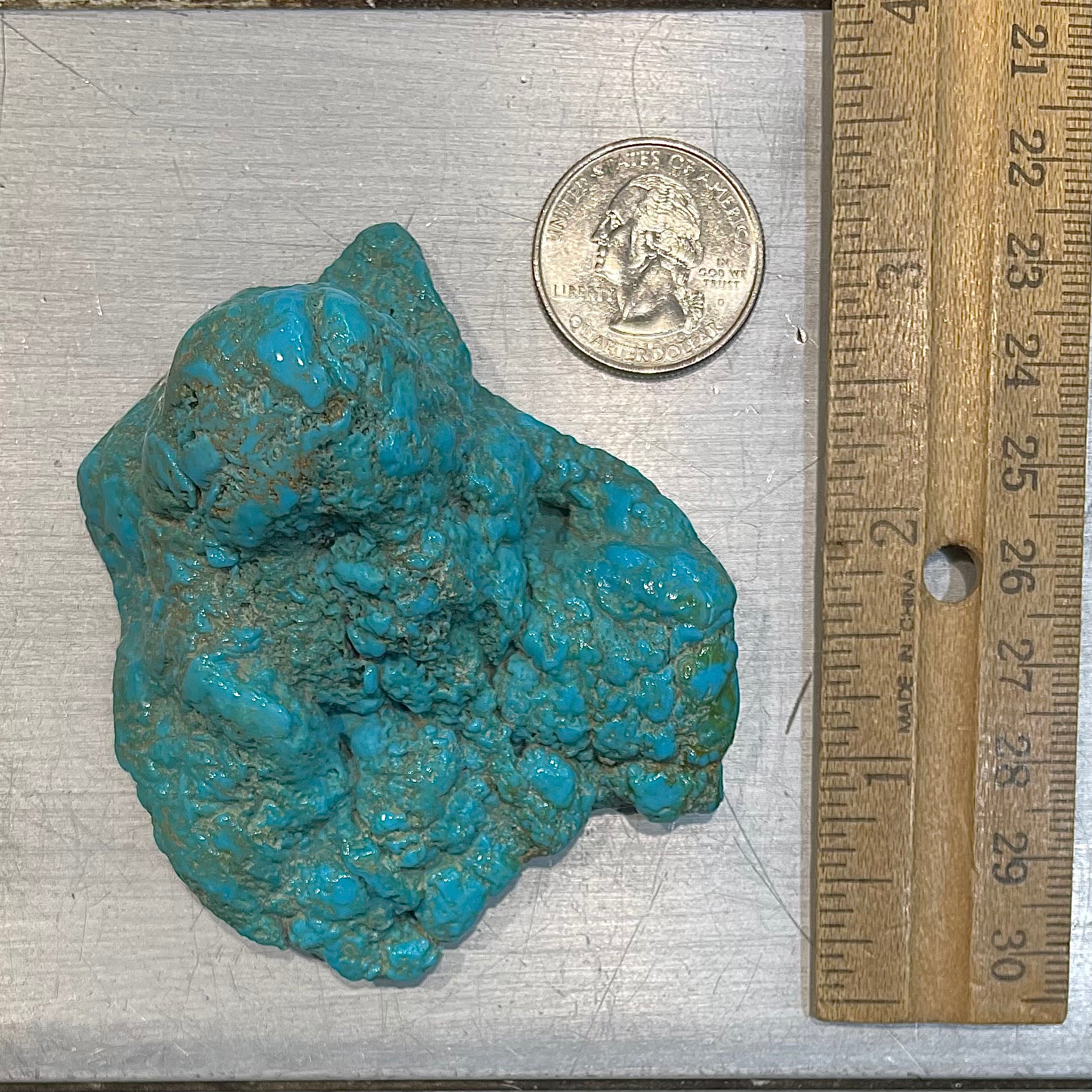 A loose, slightly polished natural turquoise nugget from Sleeping Beauty Mine, Arizona.