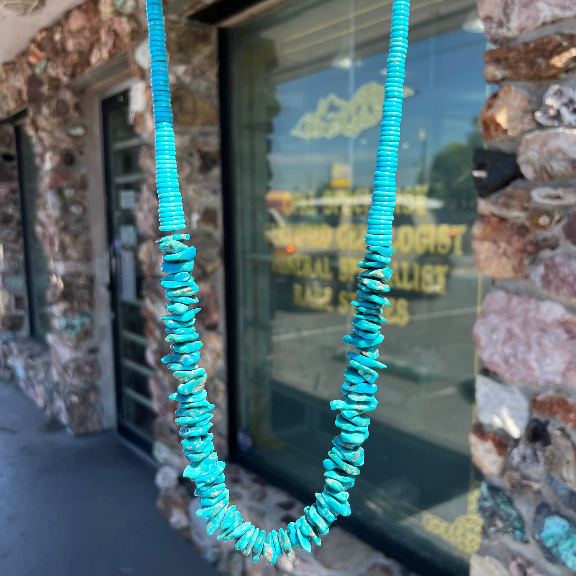 A men's turquoise stone bead necklace made from polished Kingman and Sleeping Beauty Mine turquoise.