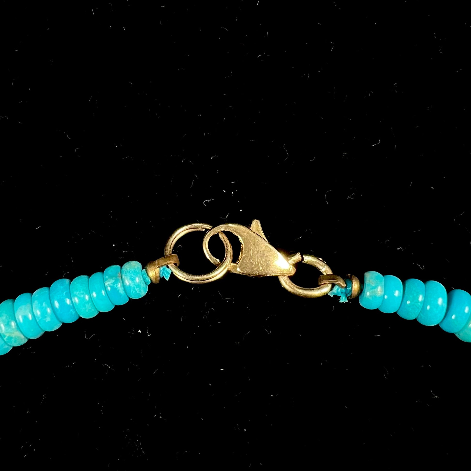 A men's turquoise stone bead necklace made from polished Kingman and Sleeping Beauty Mine turquoise.
