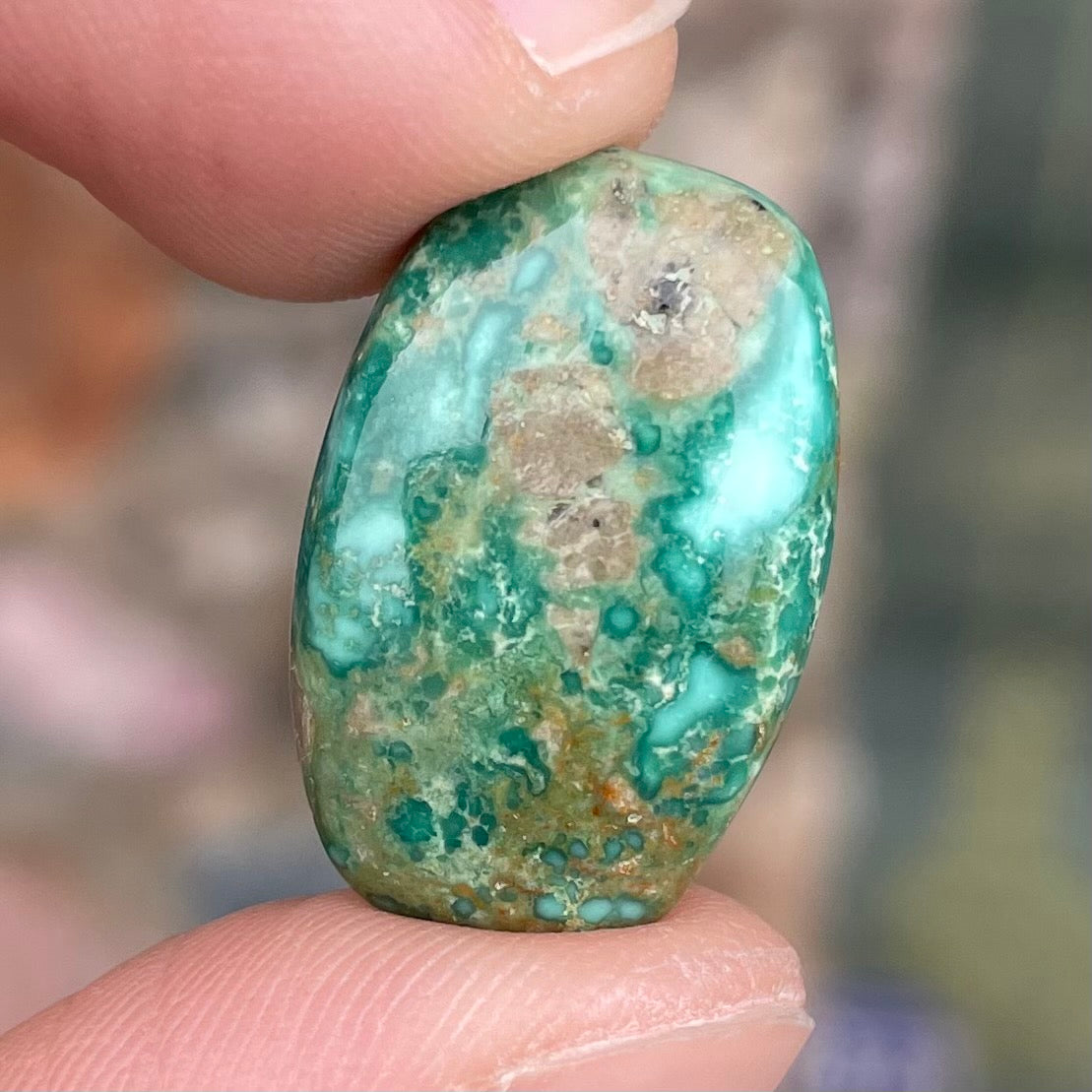 A green splotched turquoise barrel cabochon from Royston Mining District, Nevada.