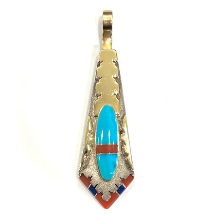 A yellow gold and sterling silver pendant inlaid with turquoise, coral, and lapis lazuli stones.  The piece is made by an unknown Native American artist and signed with the initials "LY".