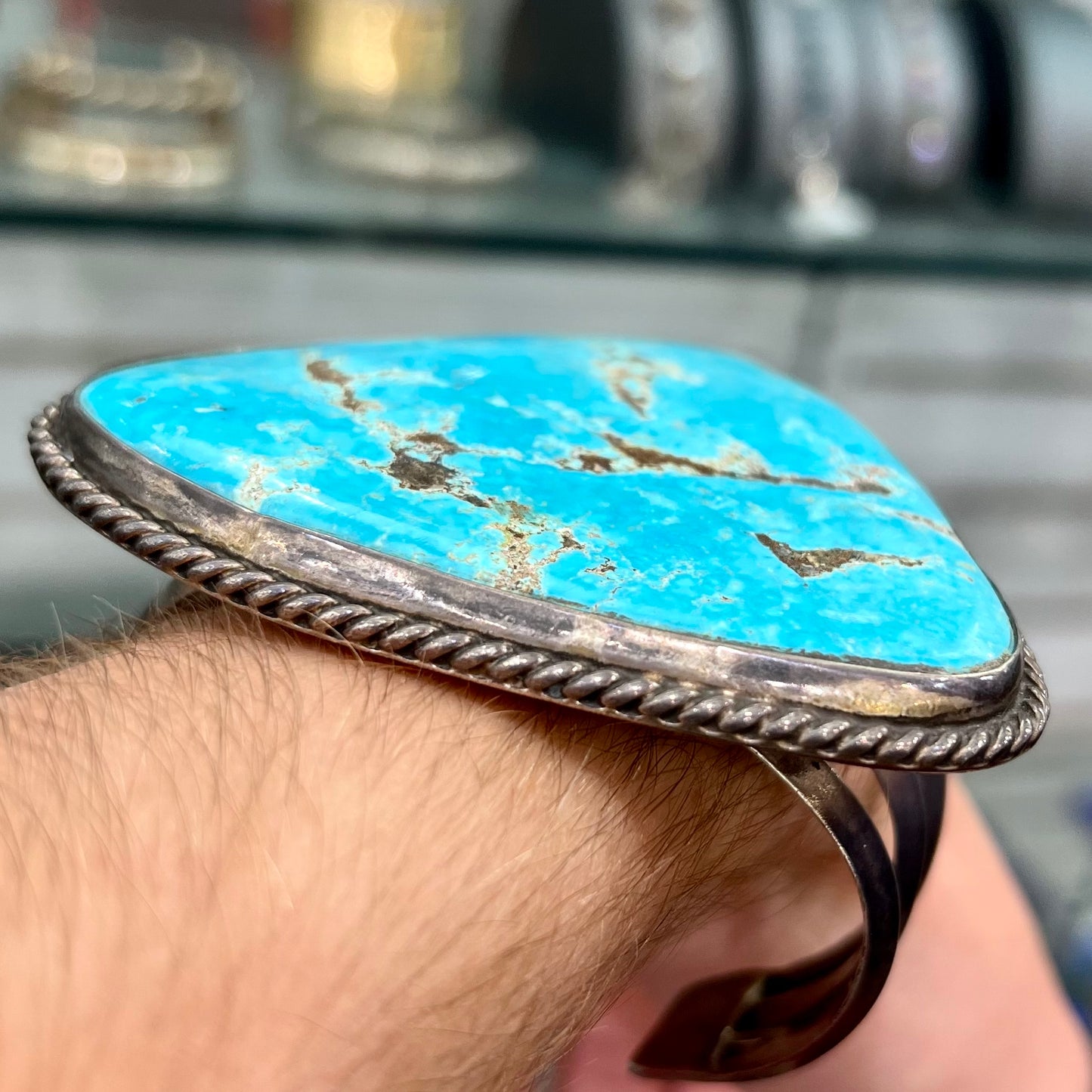 A sterling silver Morenci turquoise cuff bracelet.  The turquoise is large and has orange copper veins.