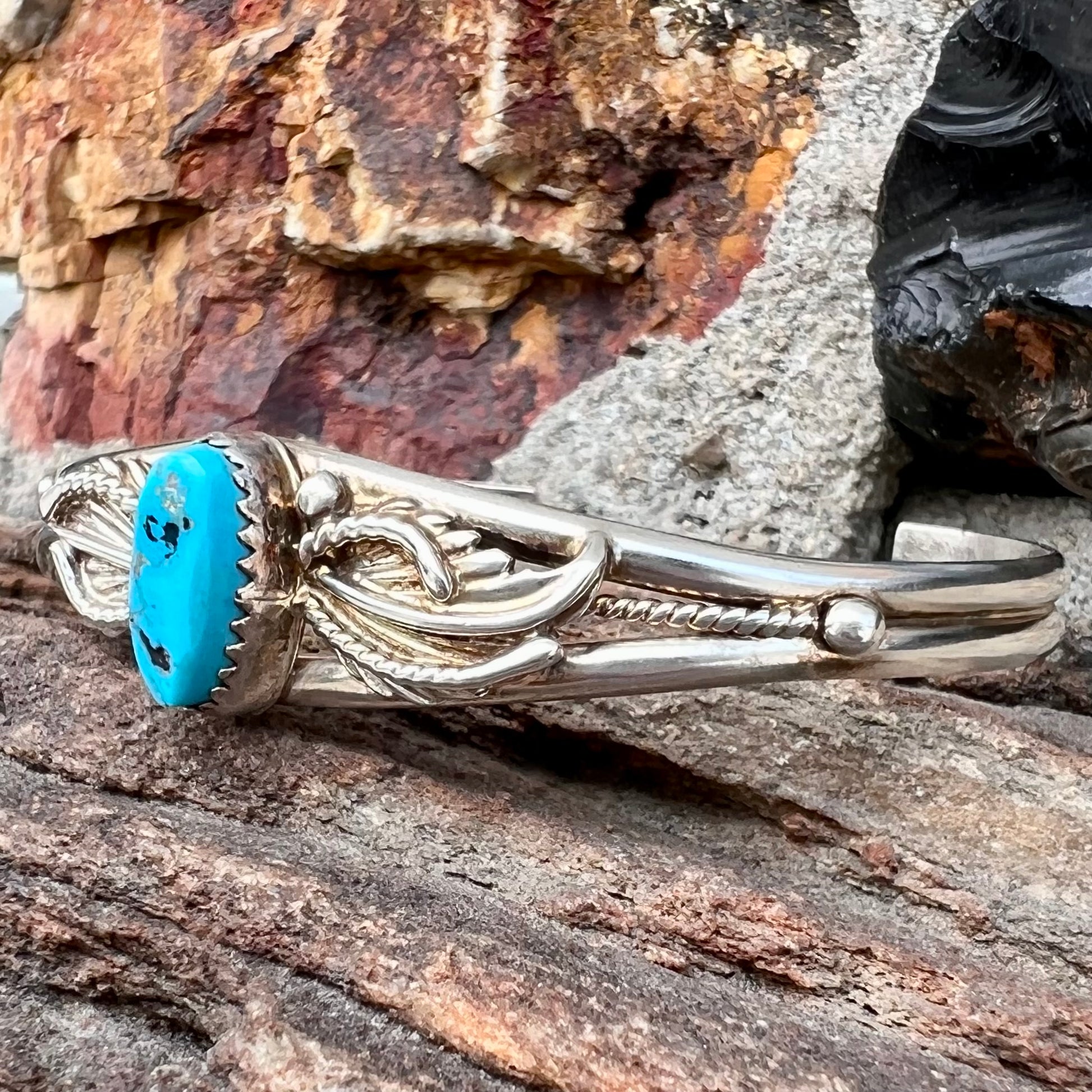 A ladies' sterling silver turquoise cuff bracelet.