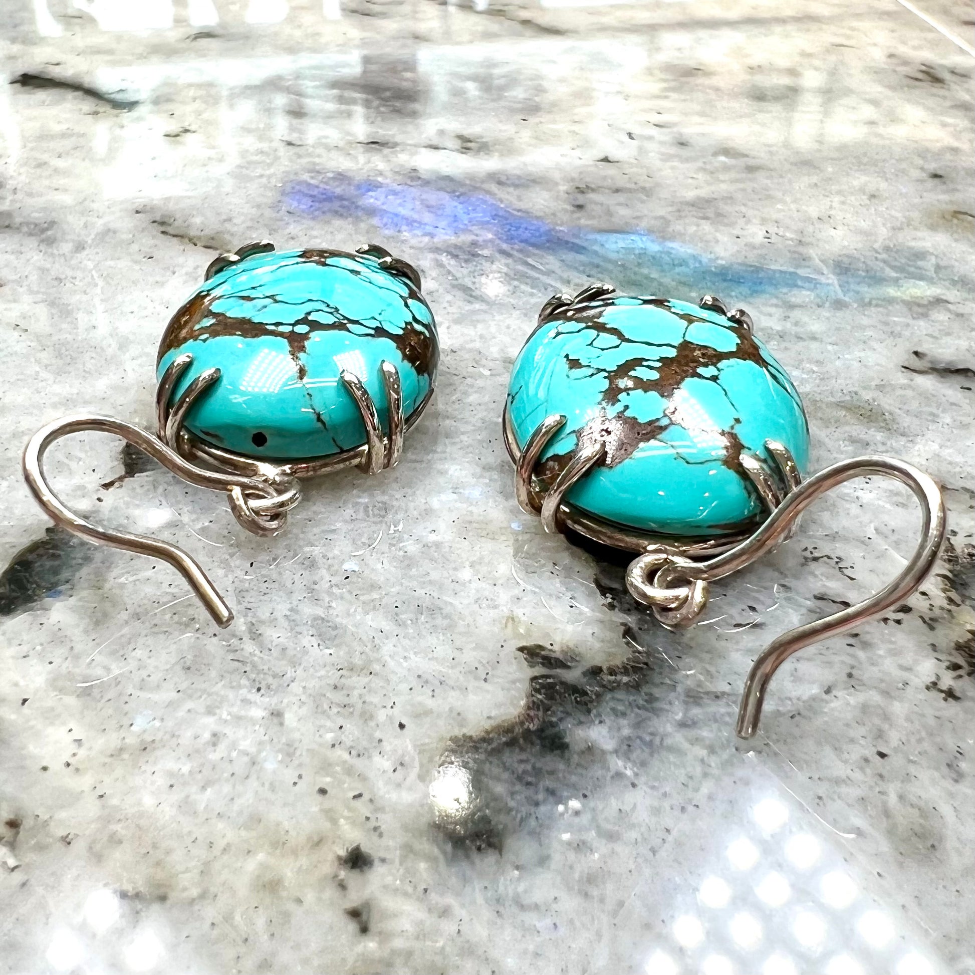 Sterling silver French wire earrings double prong set with cabochon cut turquoise from Valley Blue Mine in Lander County, Nevada.
