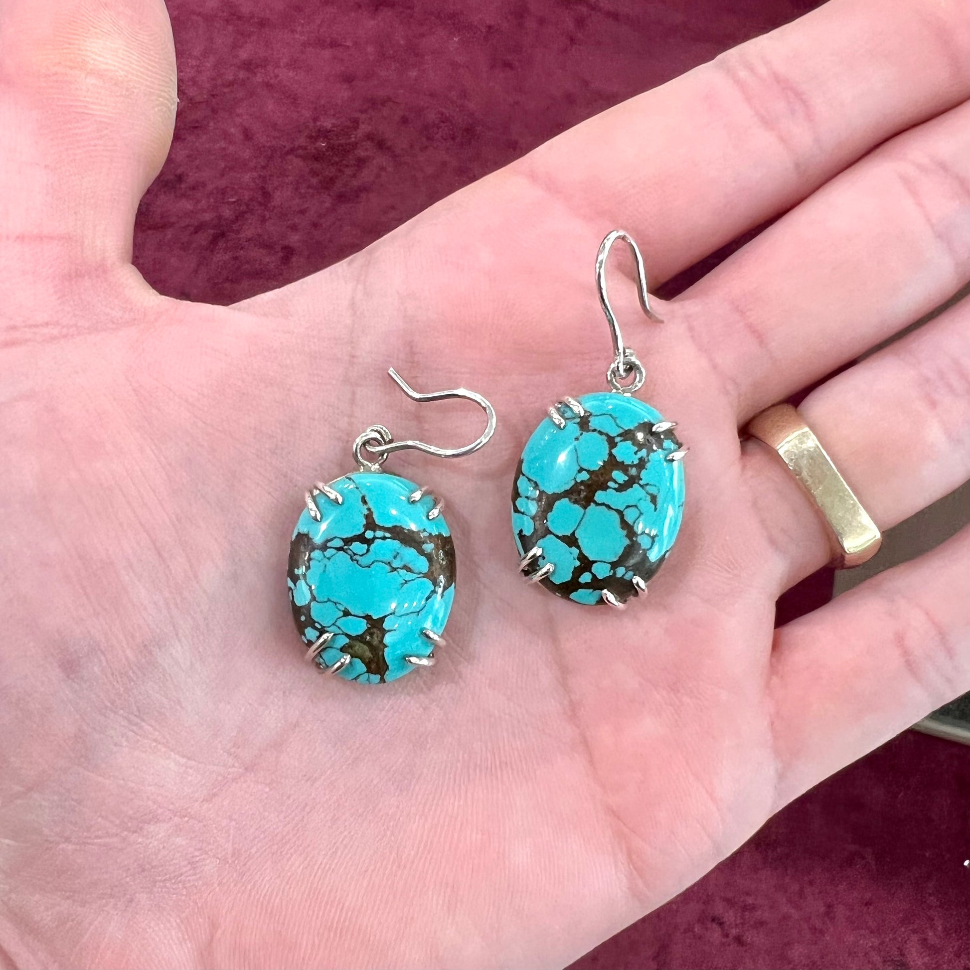 Sterling silver French wire earrings double prong set with cabochon cut turquoise from Valley Blue Mine in Lander County, Nevada.