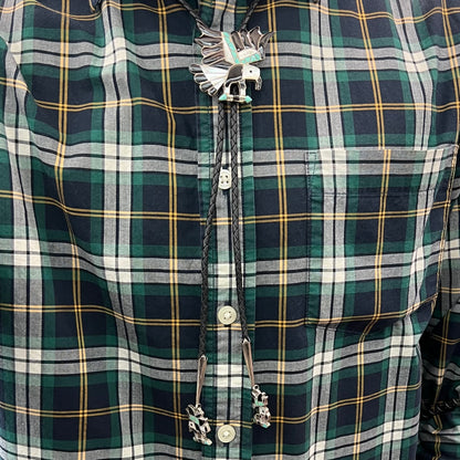 A sterling silver Zuni Indian-made bolo tie featuring the motif of three flying eagles inlaid with natural stones.