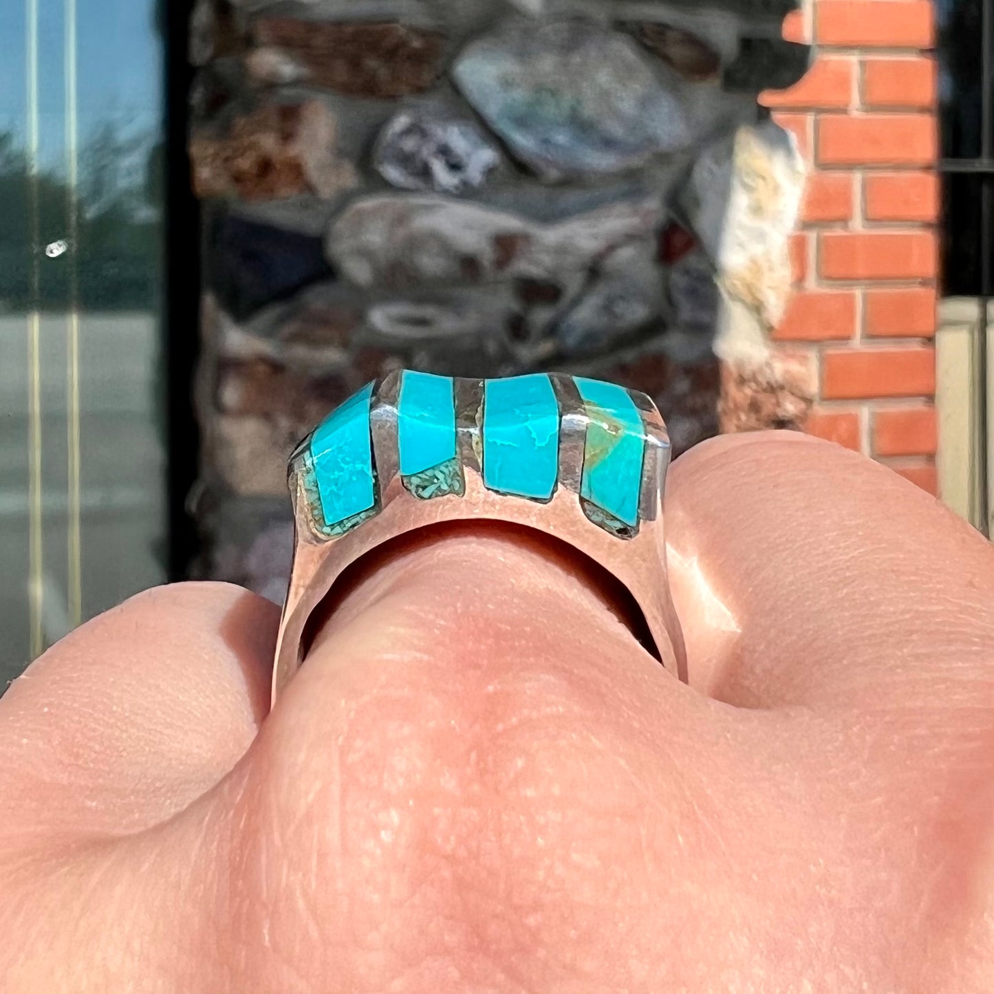 A men's turquoise ring inlay set with four turquoise stones.