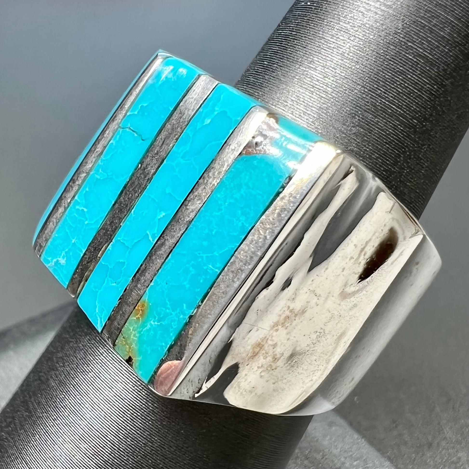 A men's turquoise ring inlay set with four turquoise stones.