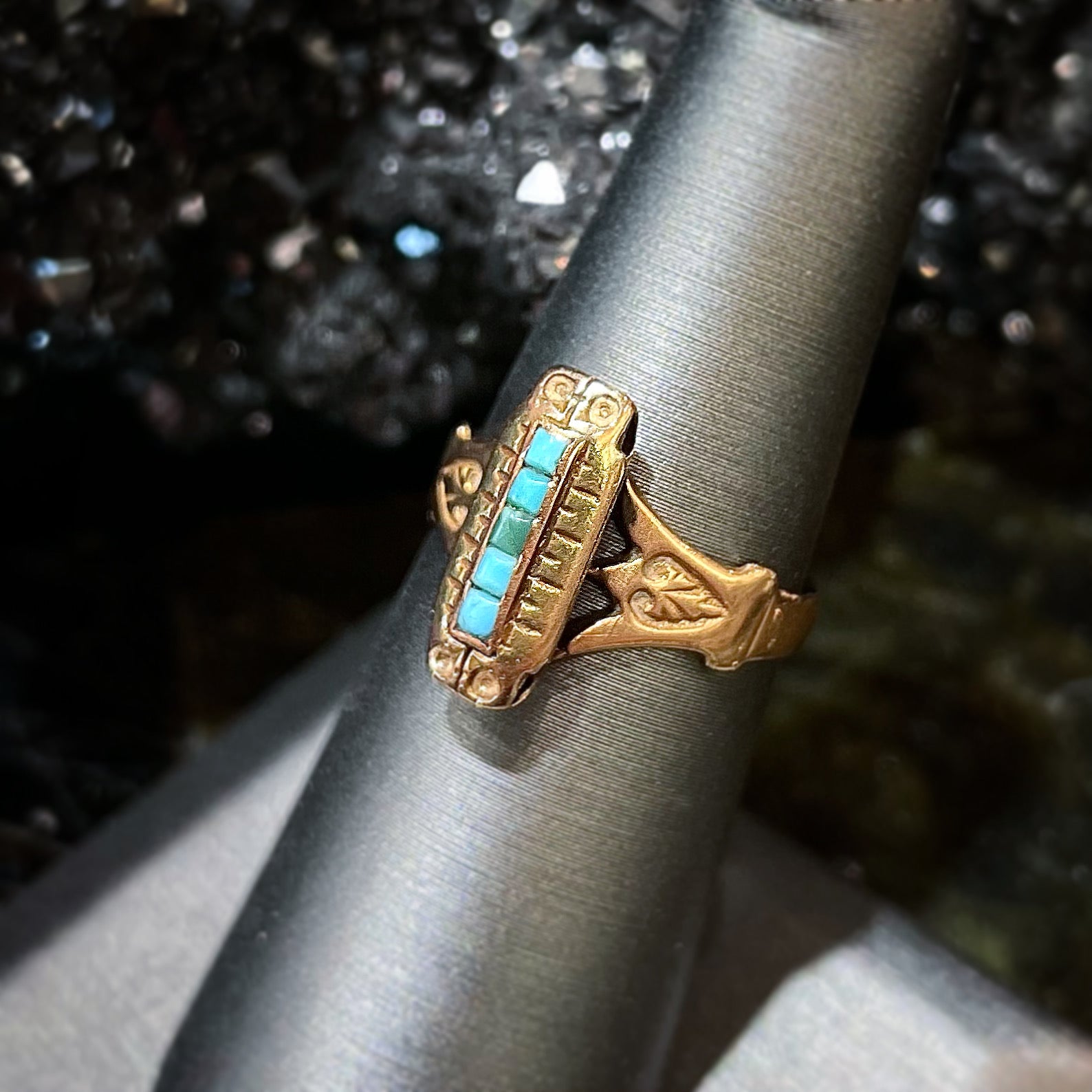 Antique yellow gold ring set with five square turquoise stones, circa 1920's.