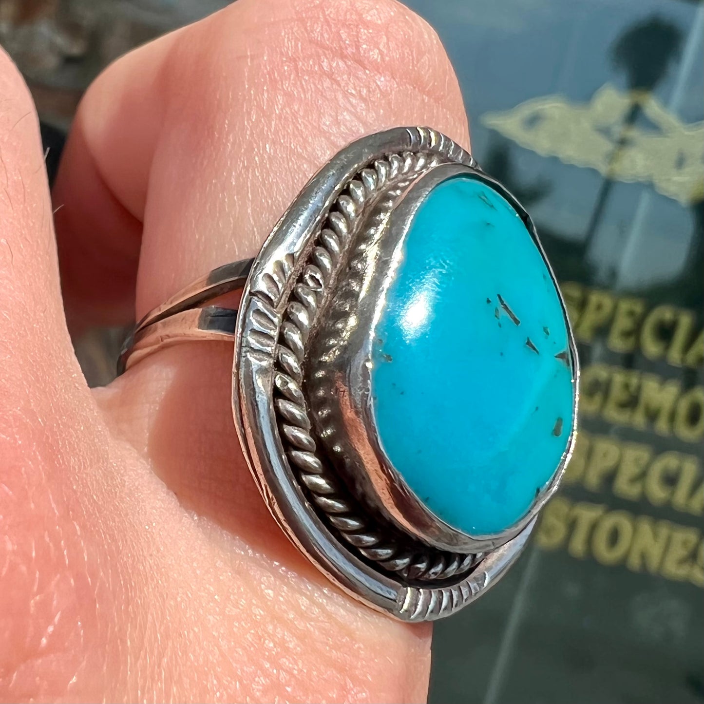 A men's silver, handmade, Navajo turquoise ring.