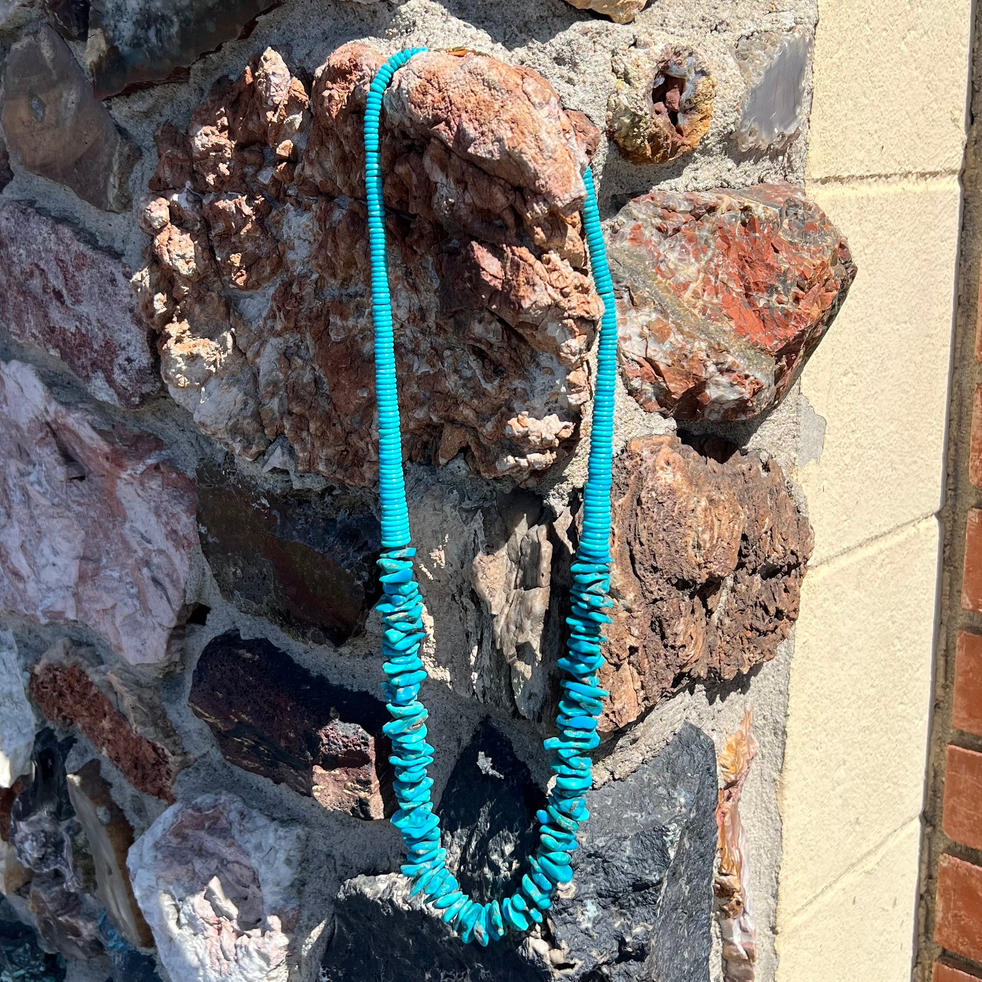 A men's turquoise stone bead necklace made from polished Kingman and Sleeping Beauty Mine turquoise.