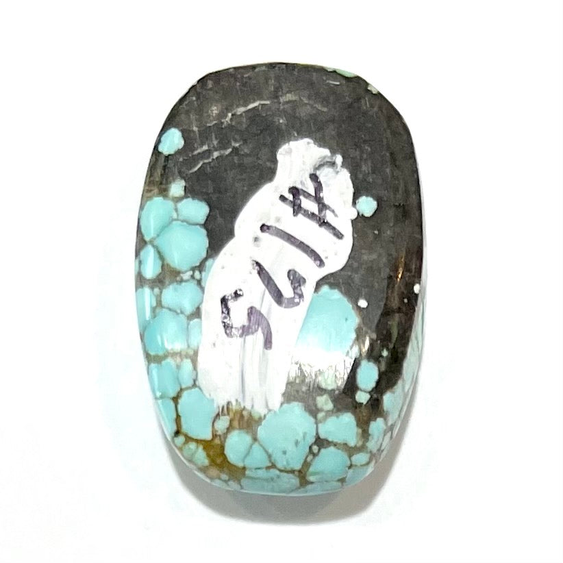 A loose spiderweb turquoise stone from Number 8 Mine, Nevada.