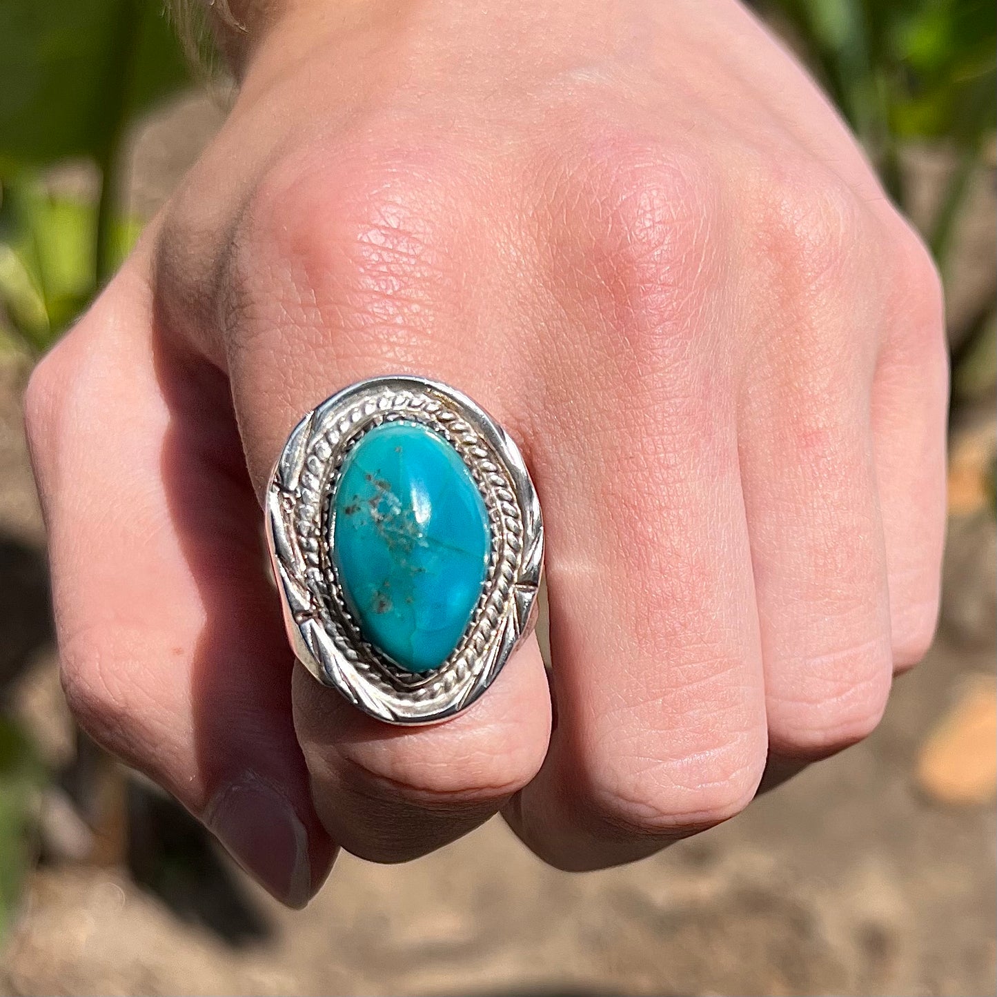 A men's sterling silver freeform cabochon cut turquoise ring.