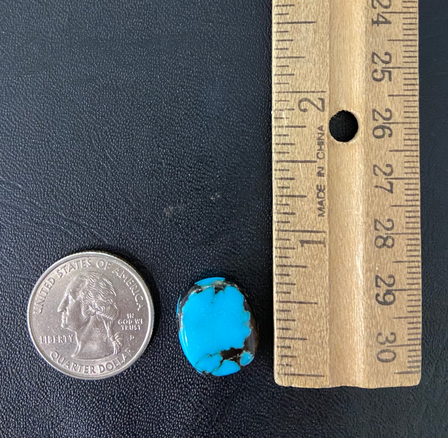 A loose turquoise stone from Pinto Valley Mine, Arizona.  The piece is blue with a black matrix.