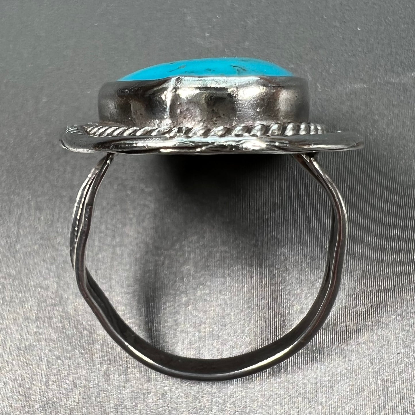 A men's silver, handmade, Navajo turquoise ring.