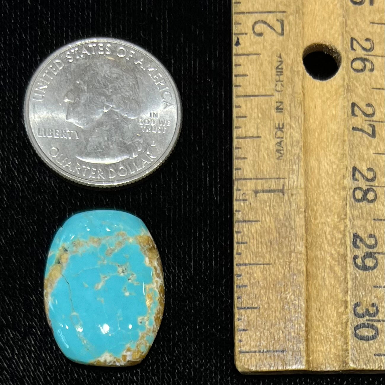 One loose polished turquoise stone cabochon from Royston Mining District.  The color is robin's egg blue with light brown matrix.