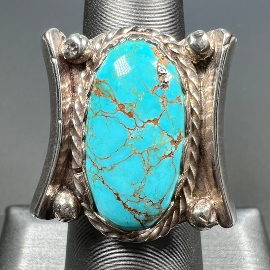 A sterling silver ring set with Tyrone turquoise from Burro Mountains, New Mexico.