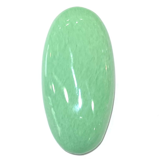 A loose, oval cabochon cut variscite stone from Utah, USA.