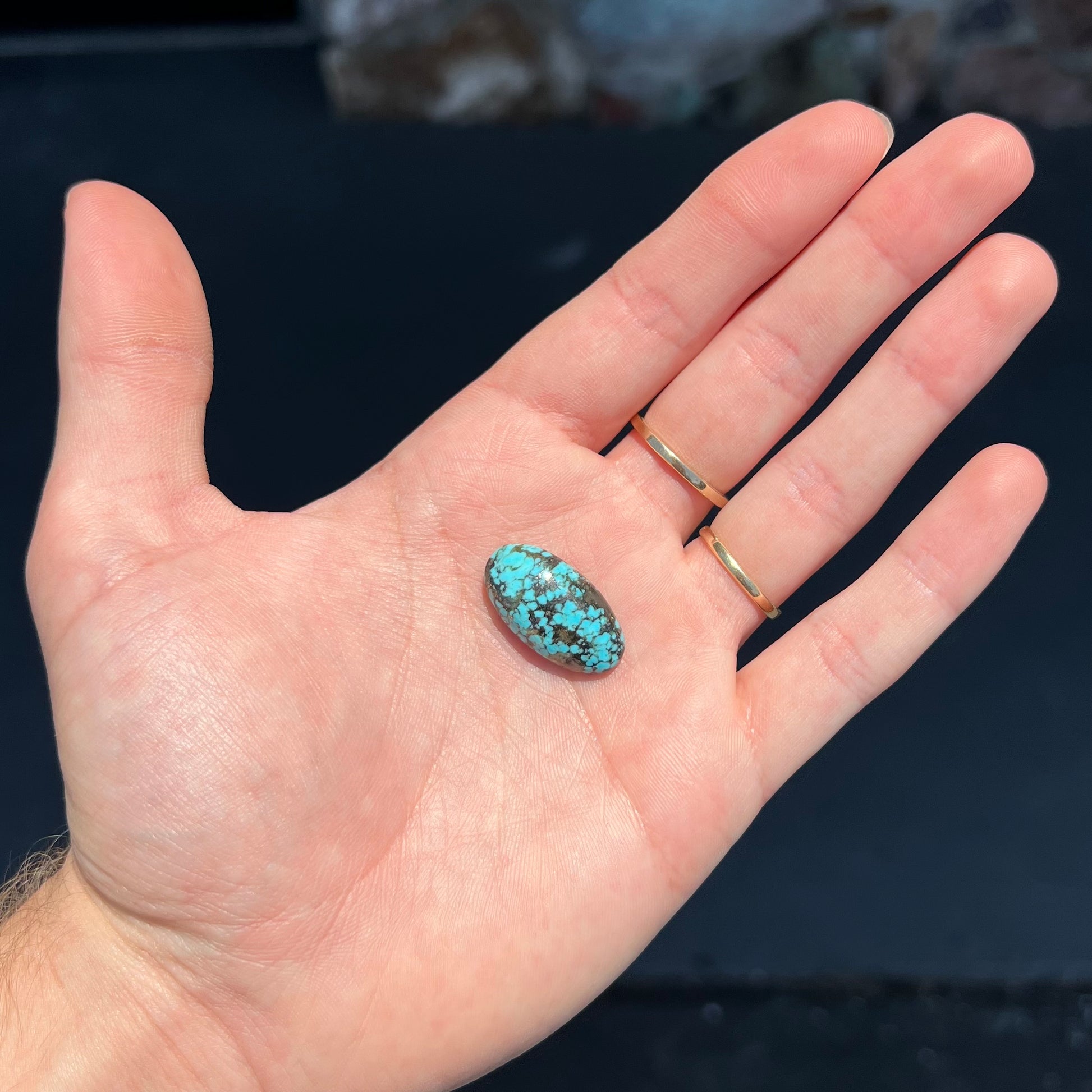 A loose, oval cabochon cut turquoise stone from the Valley Blue Mine in Lander County, Nevada.