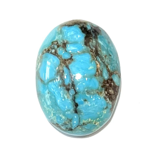 A loose, oval cabochon cut turquoise stone from the Valley Blue Mine in Lander County, Nevada.