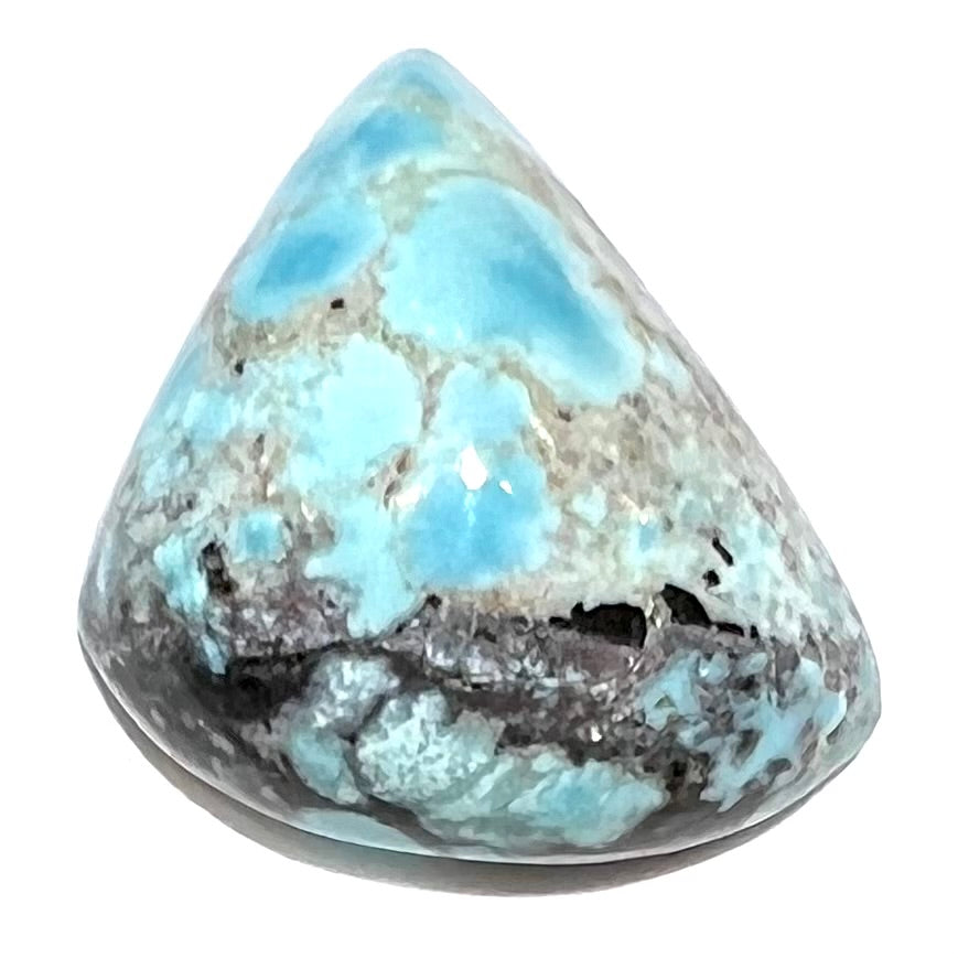 A loose triangular cabochon cut turquoise from the Valley Blue Mine in Lander County, Nevada.