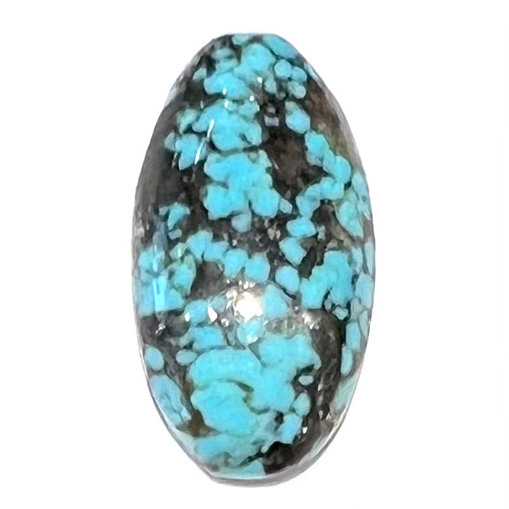 A loose, oval cabochon cut turquoise stone from the Valley Blue Mine in Lander County, Nevada.
