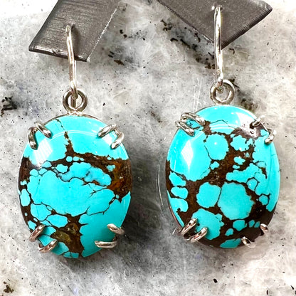Sterling silver French wire earrings double prong set with cabochon cut turquoise from Valley Blue Mine in Lander County, Nevada.
