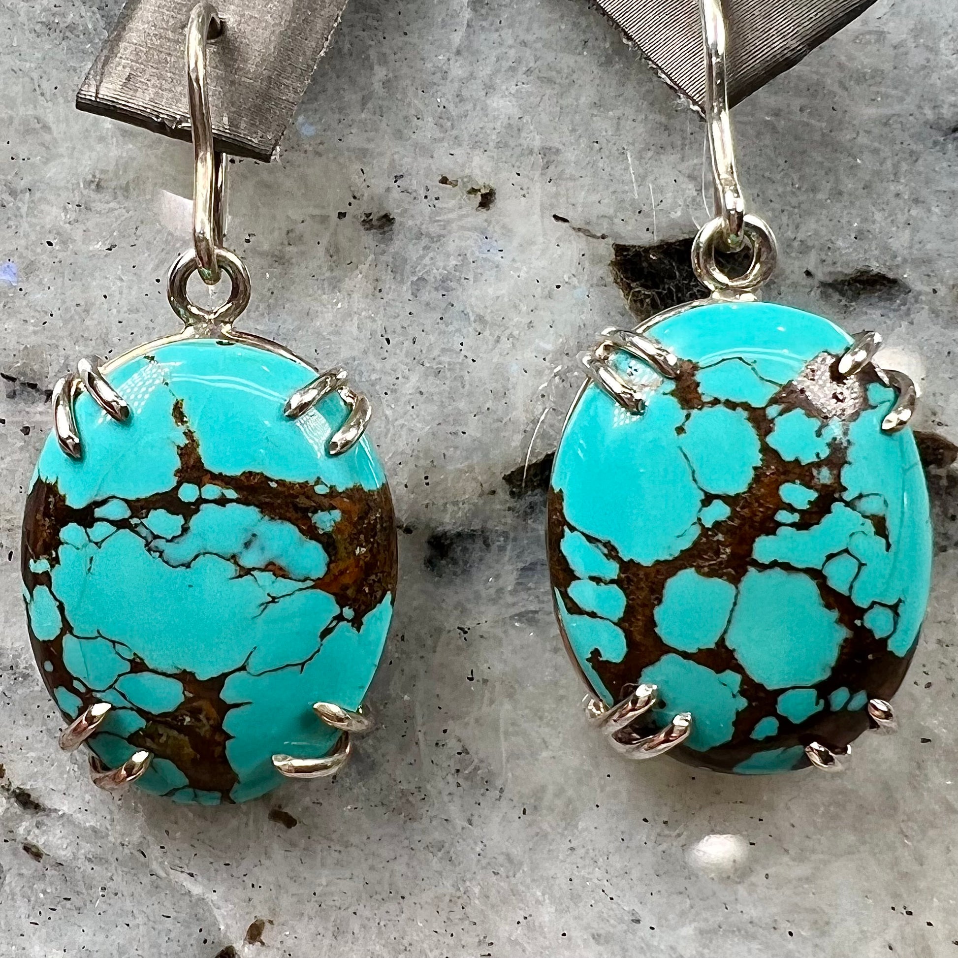 Sterling silver French wire earrings double prong set with cabochon cut turquoise from Valley Blue Mine in Lander County, Nevada.