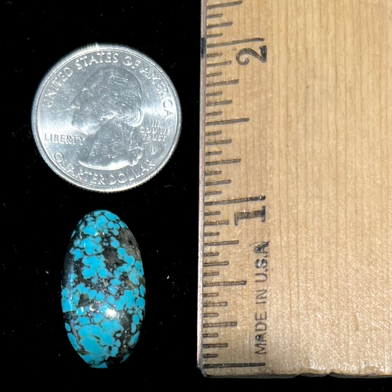 A loose, oval cabochon cut turquoise stone from the Valley Blue Mine in Lander County, Nevada.