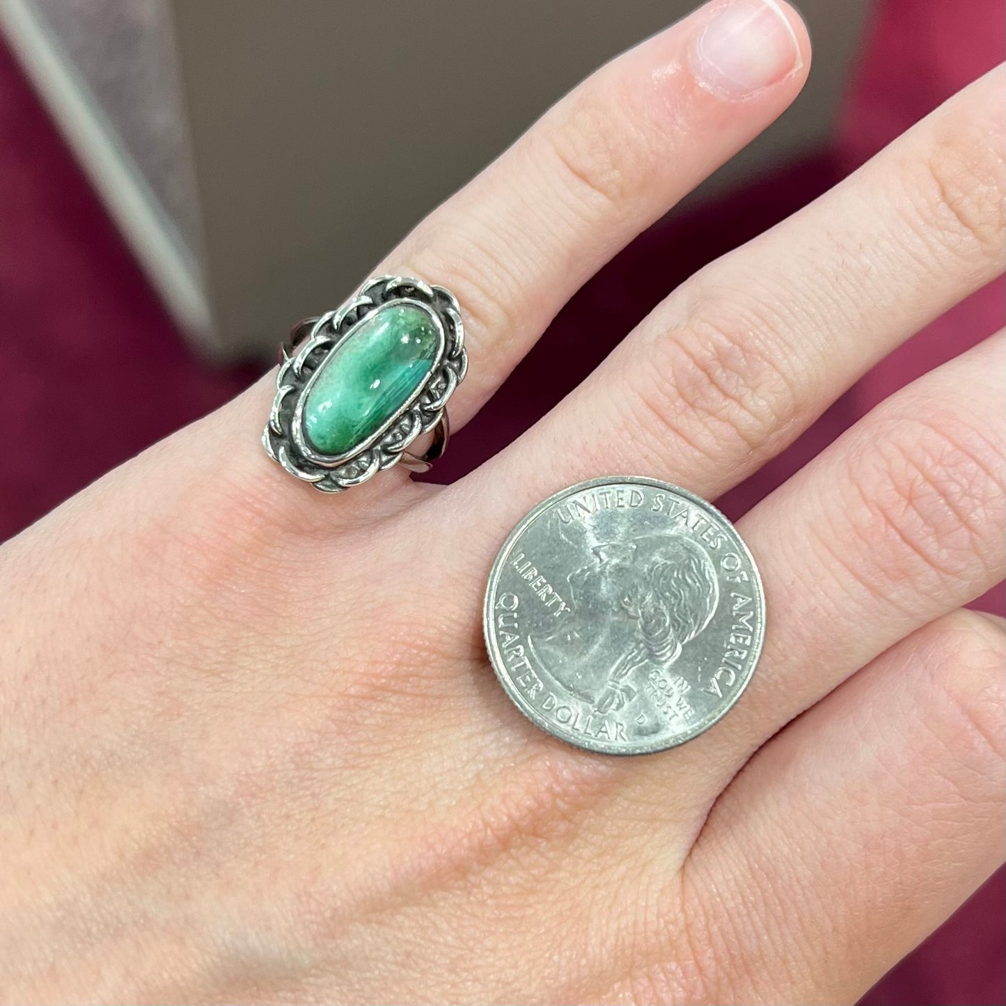 A handmade, split shank, sterling silver ring bezel set with a green variscite stone from Utah, USA.