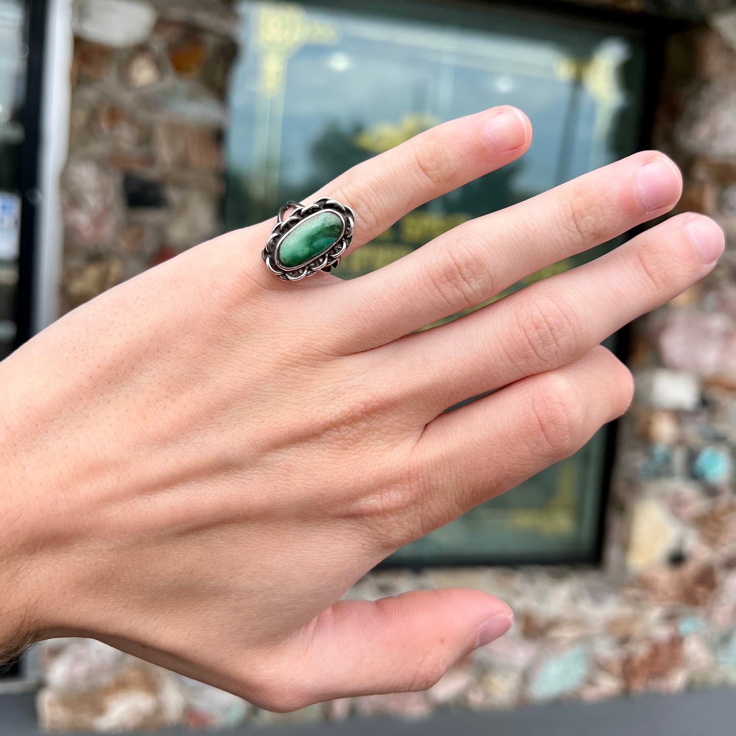 A handmade, split shank, sterling silver ring bezel set with a green variscite stone from Utah, USA.