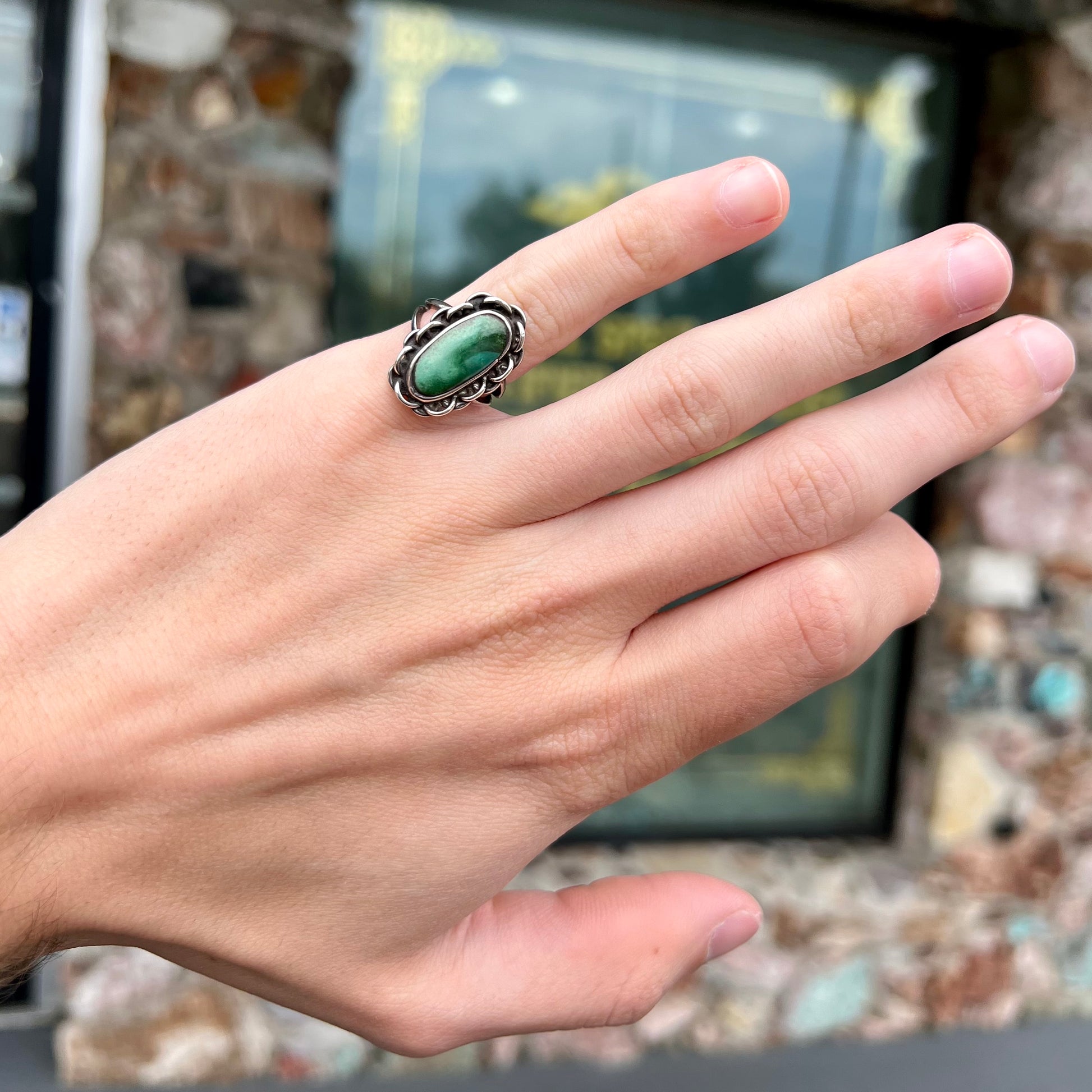 A handmade, split shank, sterling silver ring bezel set with a green variscite stone from Utah, USA.