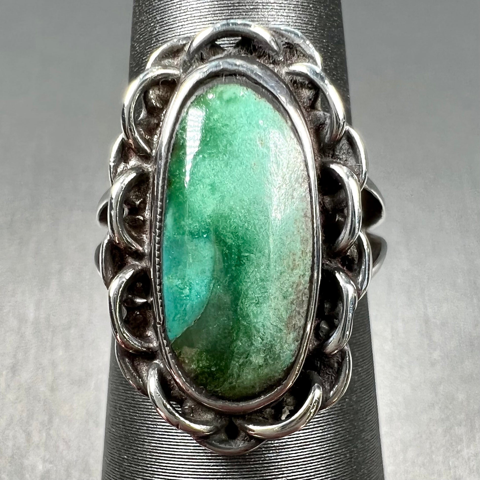 A handmade, split shank, sterling silver ring bezel set with a green variscite stone from Utah, USA.