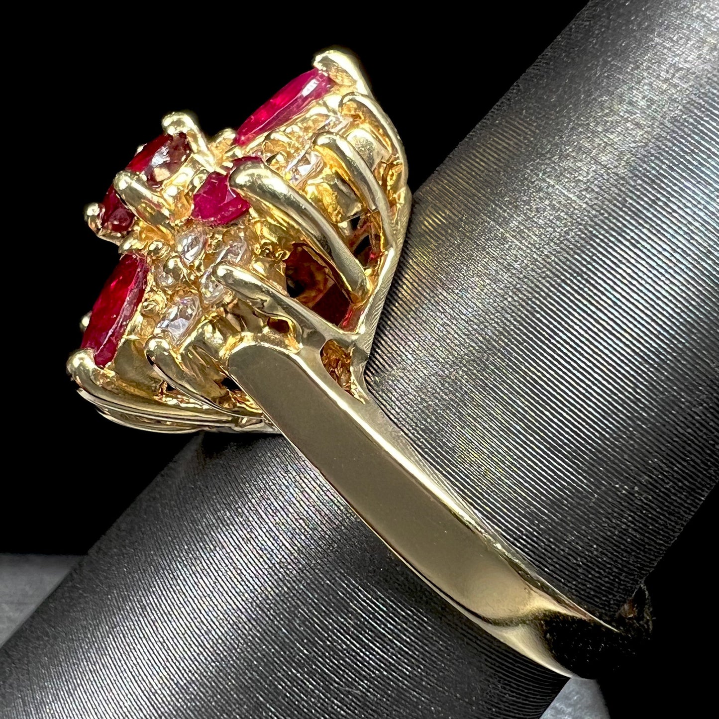 A ladies' vintage yellow gold cluster ring set with diamonds and pigeon blood red Burma rubies.
