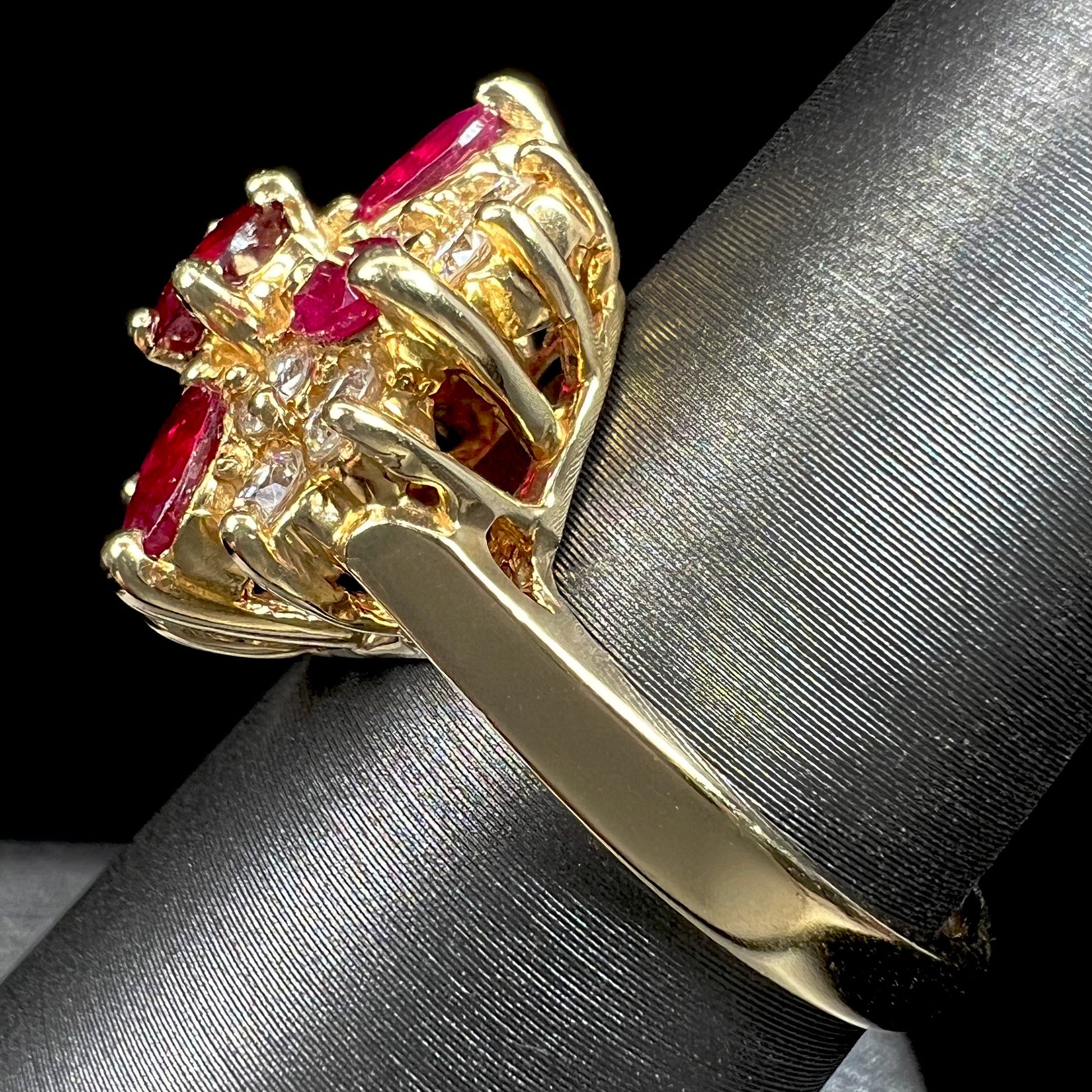 A ladies' vintage yellow gold cluster ring set with diamonds and pigeon blood red Burma rubies.