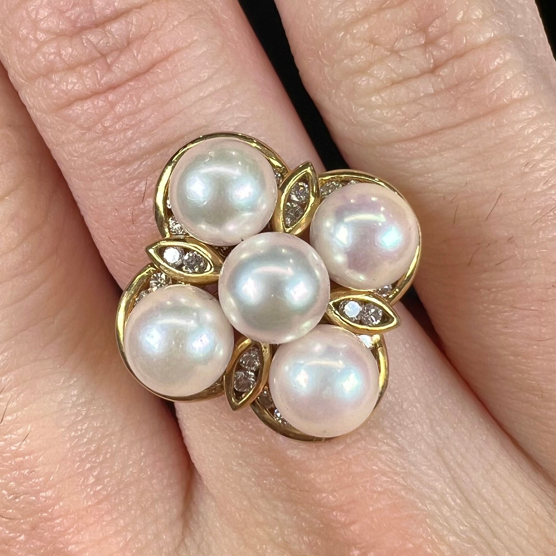 A ladies' vintage 1960's pink Akoya pearl and diamond quatrefoil ring.  The shank of the ring is textured.