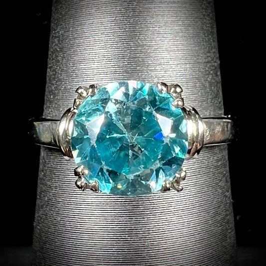 A ladies' vintage white gold solitaire ring set with a round brilliant cut blue zircon stone.