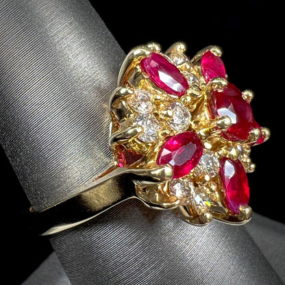 A ladies' vintage yellow gold cluster ring set with diamonds and pigeon blood red Burma rubies.