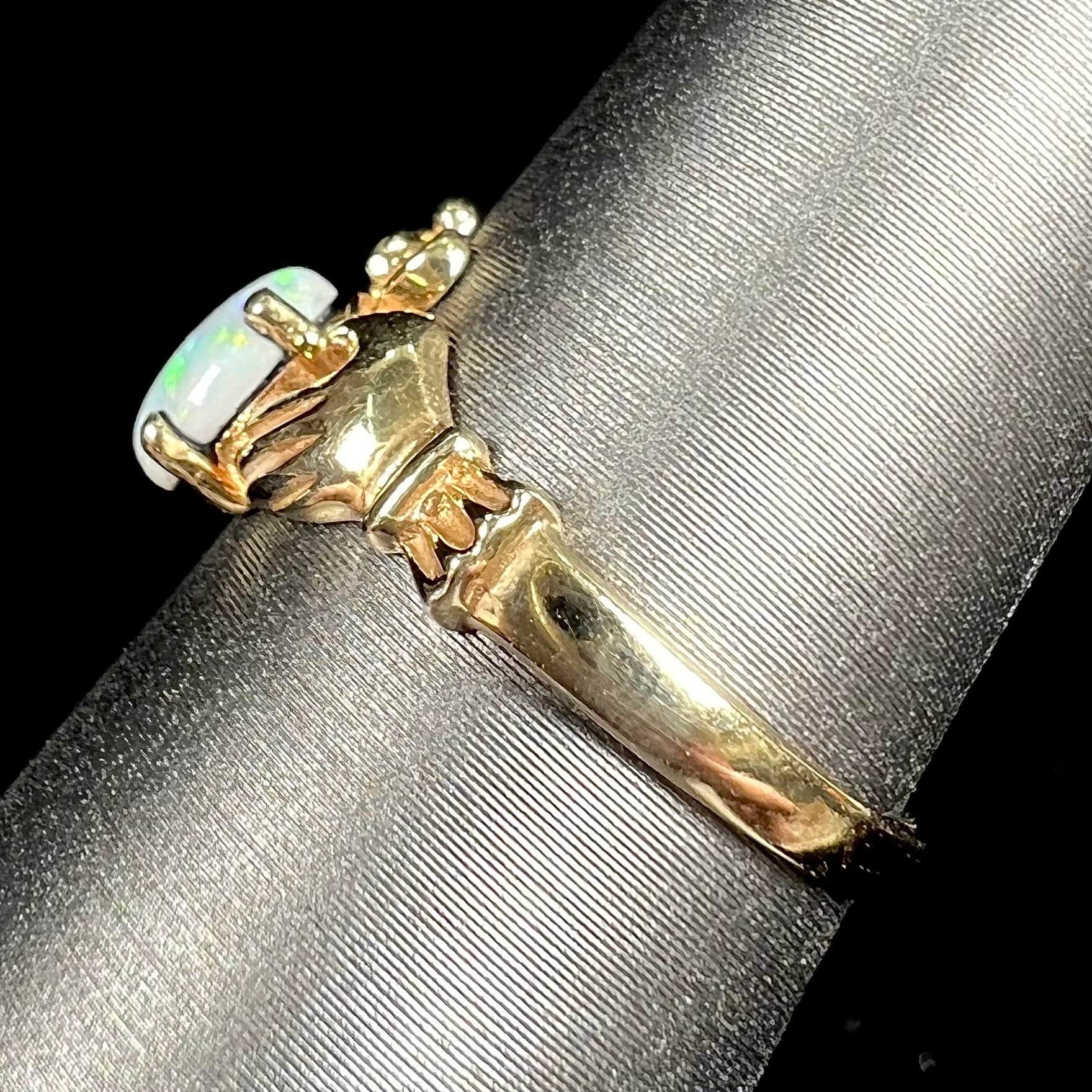 A vintage ladies' yellow gold opal and diamond claddagh ring.