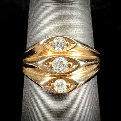 A vintage 1940's style ladies' yellow gold three stone diamond ring.