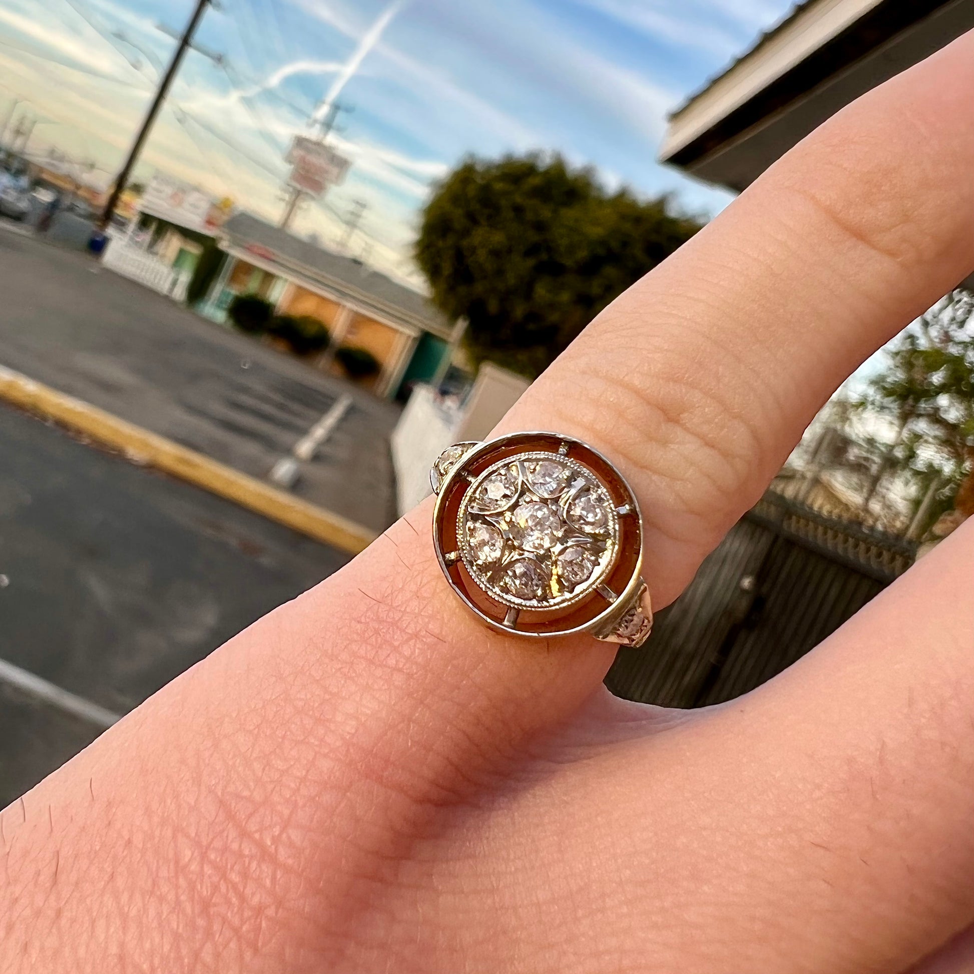 An antique yellow gold ring set with a cluster of old European cut diamonds.