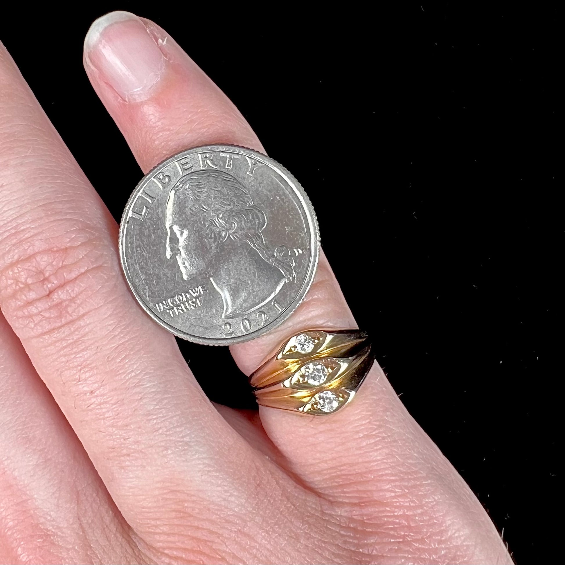 A vintage 1940's style ladies' yellow gold three stone diamond ring.