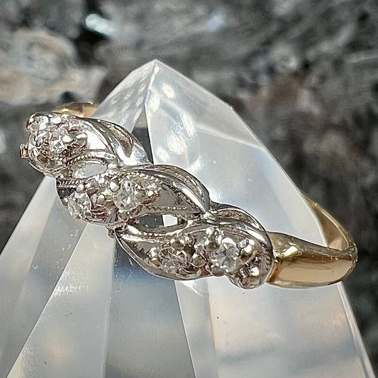 A vintage two tone diamond band set with single cut diamonds.