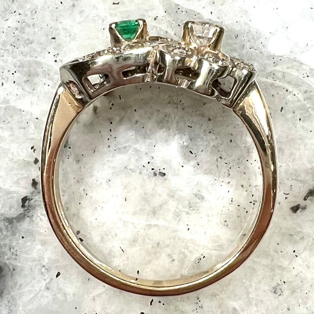 Vintage gold round cut emerald and diamond ring.