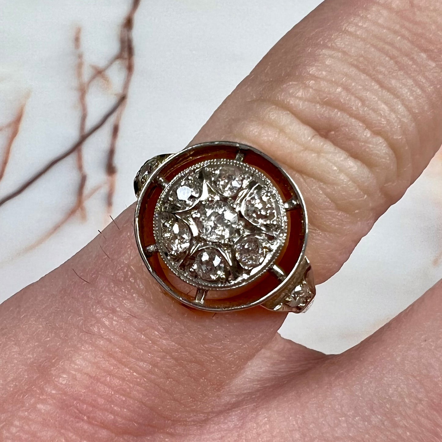 An antique yellow gold ring set with a cluster of old European cut diamonds.