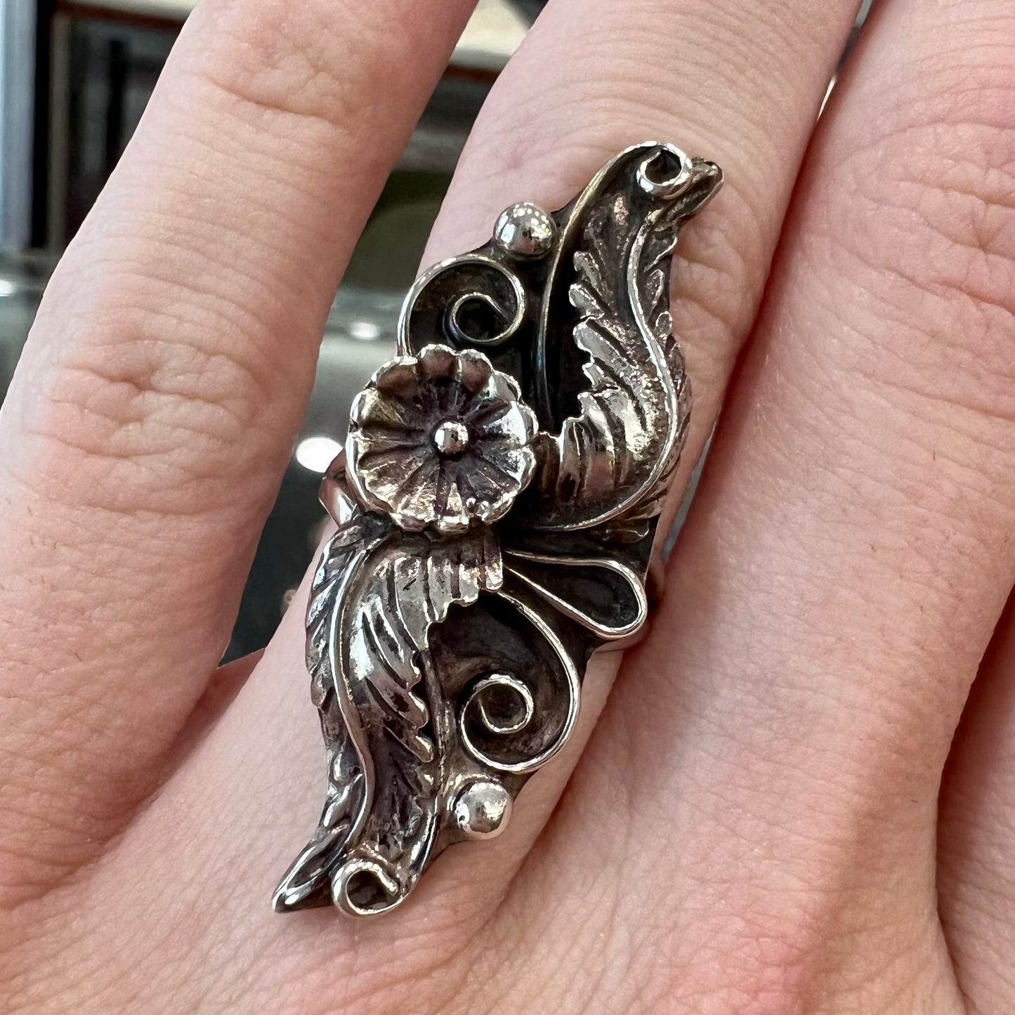 A sterling silver Navajo flower ring.