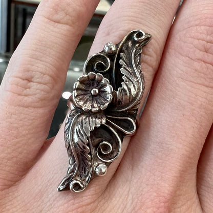 A sterling silver Navajo flower ring.